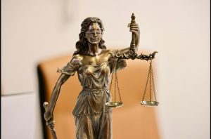 Bronze statue of Lady Justice holding the scales of justice, symbolizing the legal profession in Canada