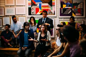Audience members listening and asking questions during a career panel discussion